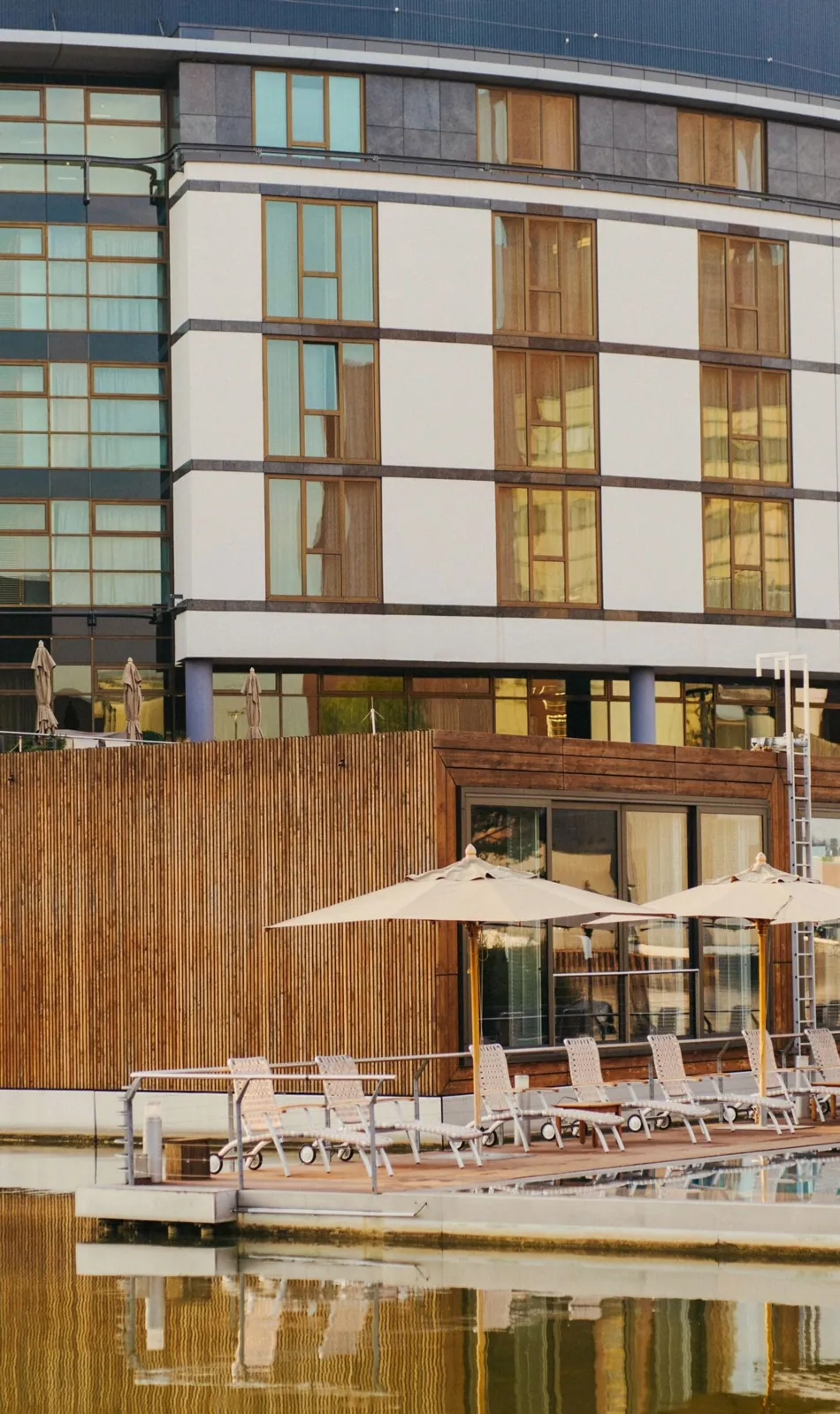 The Ritz-Carlton, Wolfsburg — exterior with floating pool over the lagoon