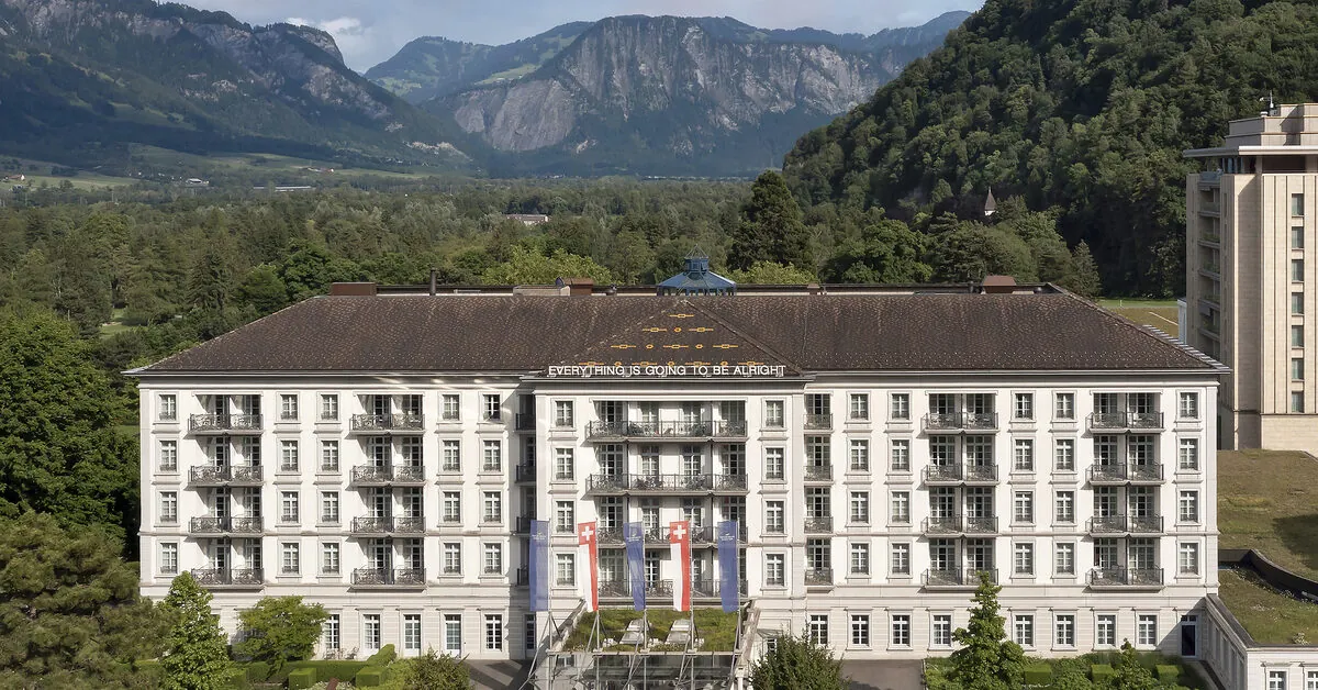 Grand Resort Bad Ragaz from the south, showing the Quellenhof and Hof Ragaz wings against the Calanda massif.