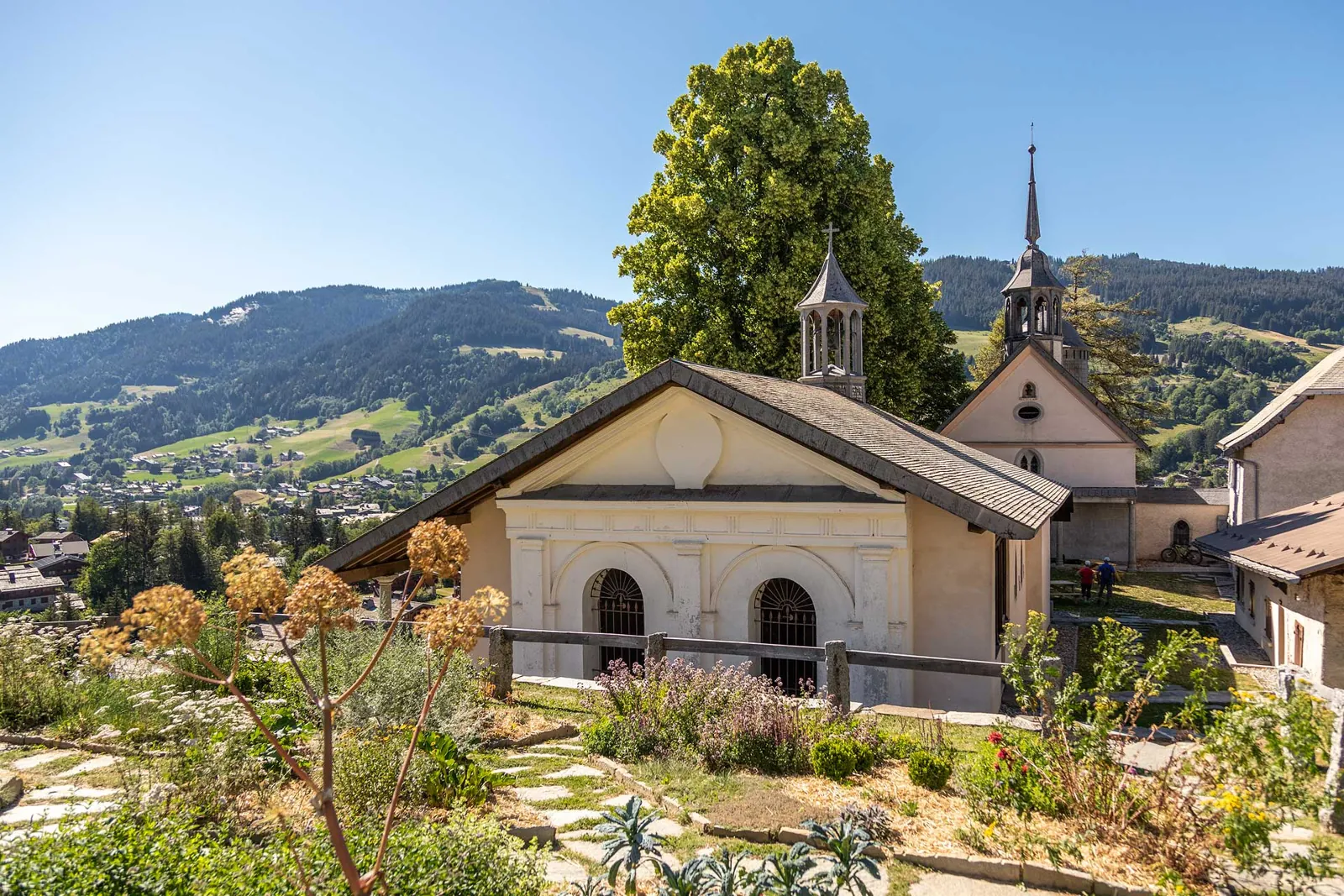 Megève village in summer — calvaire above alpine meadows