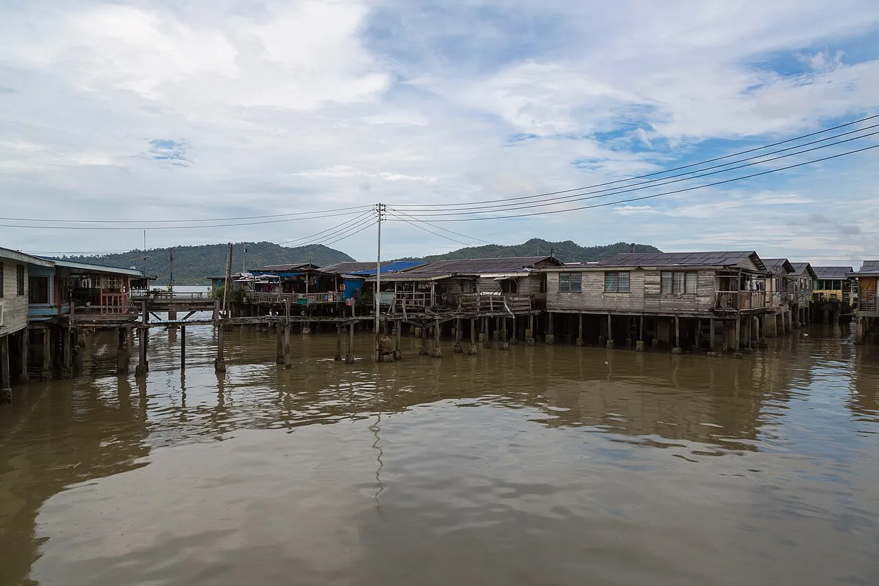 Sim Sim Water Village — wooden stilt houses on the sea, linked by plank walkways