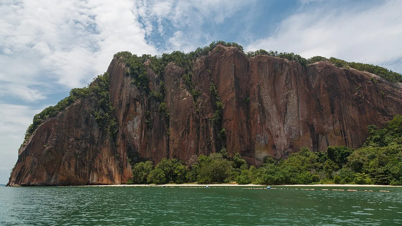 Pulau Berhala's cliffs seen from the sea off Sandakan
