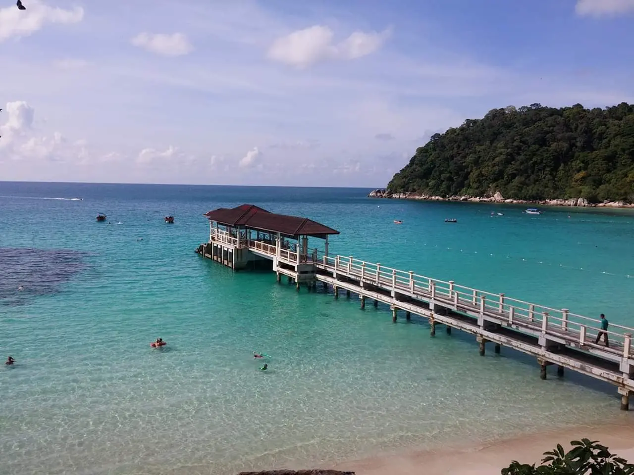 Turquoise water and jungle shoreline of the Perhentian Islands