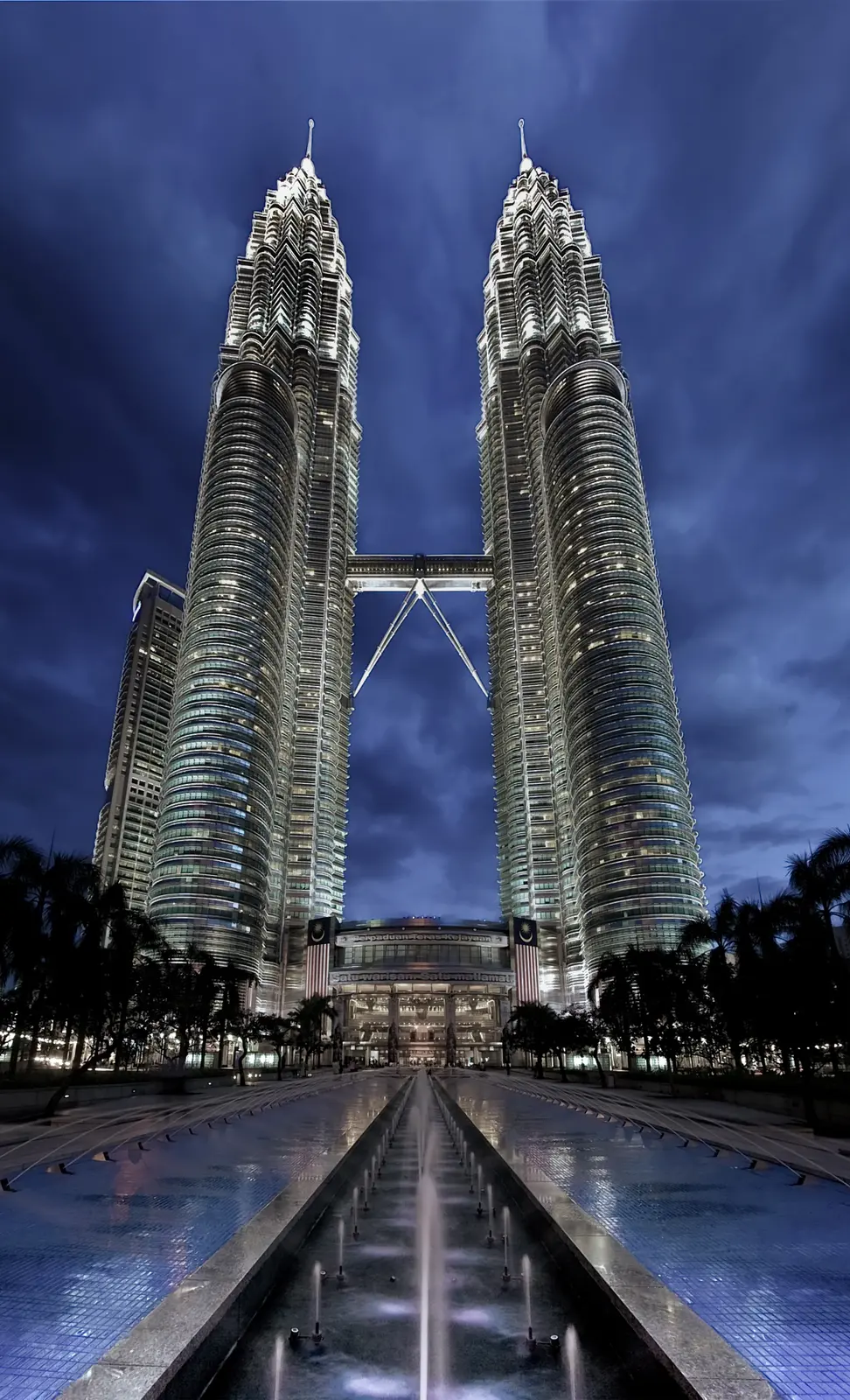 The Petronas Twin Towers lit up at dusk in Kuala Lumpur