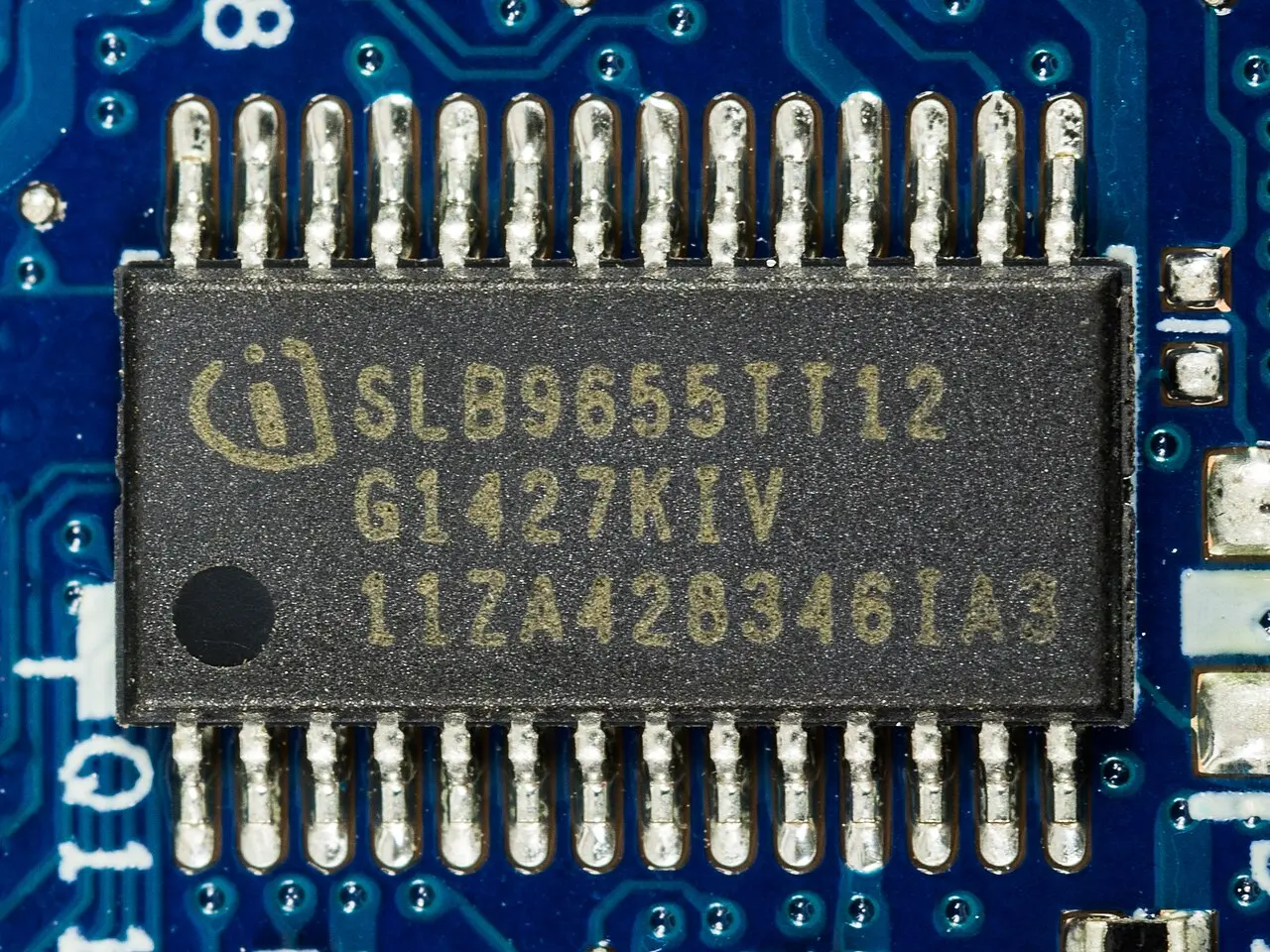A discrete Trusted Platform Module chip soldered on a laptop motherboard