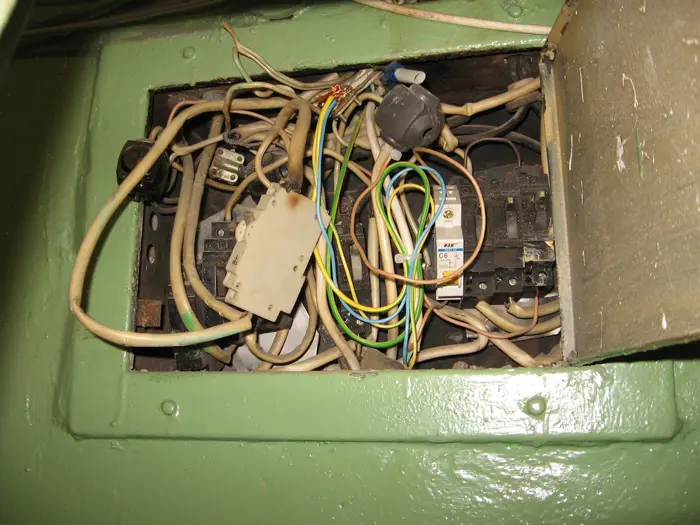 A row of installed circuit breakers in a distribution board