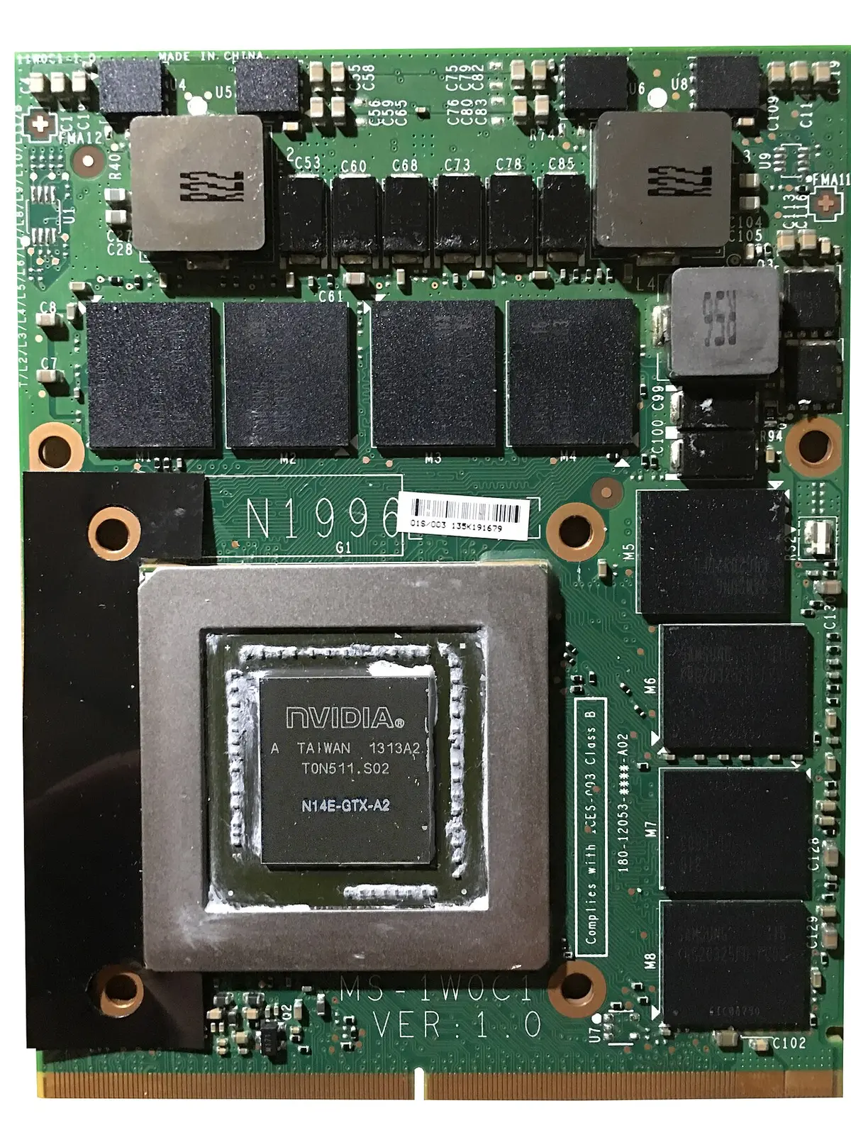 A laptop MXM graphics module with a bare NVIDIA GPU die