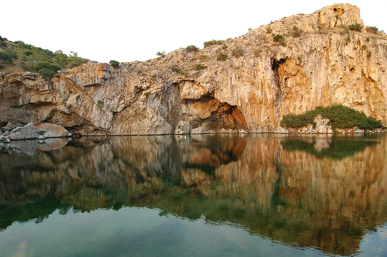 Lake Vouliagmeni under its cliff