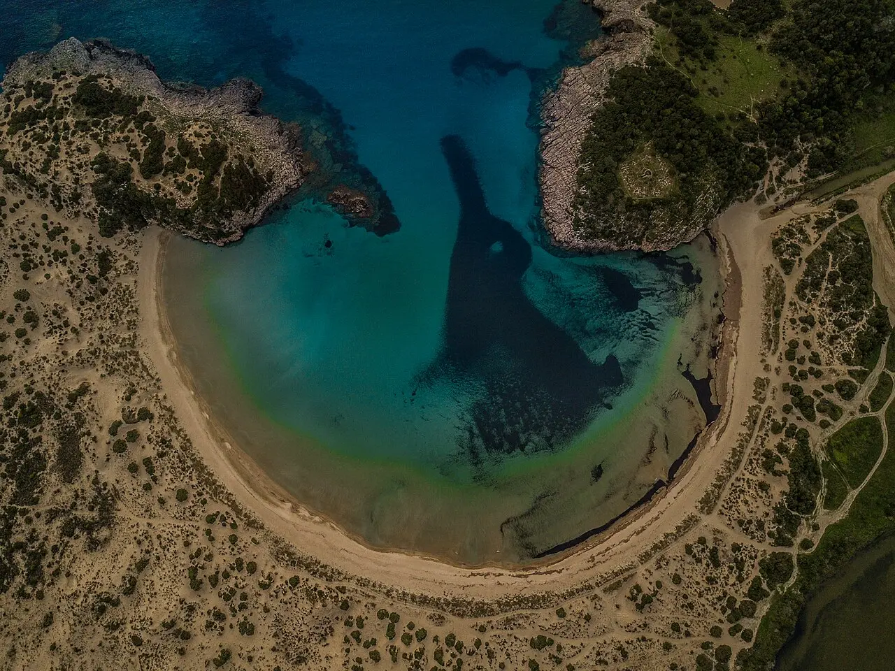 The horseshoe bay of Voidokilia beach seen from directly above