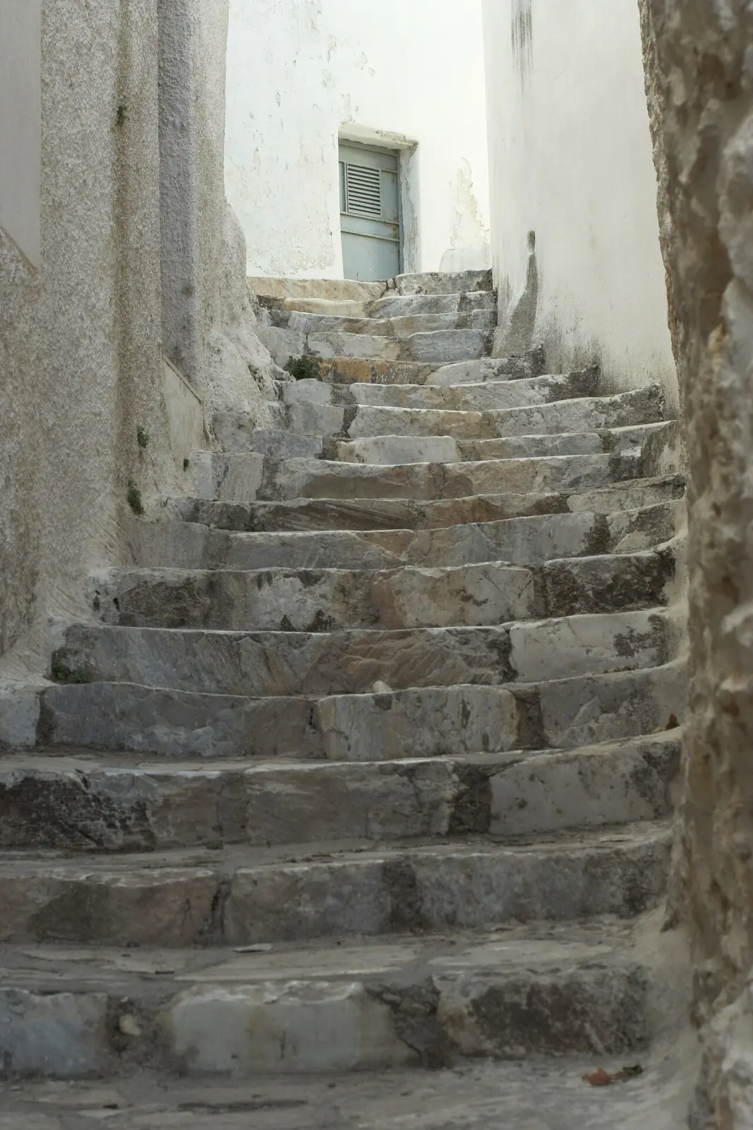 A marble-paved alley with arches in Apeiranthos, the mountain village of Naxos