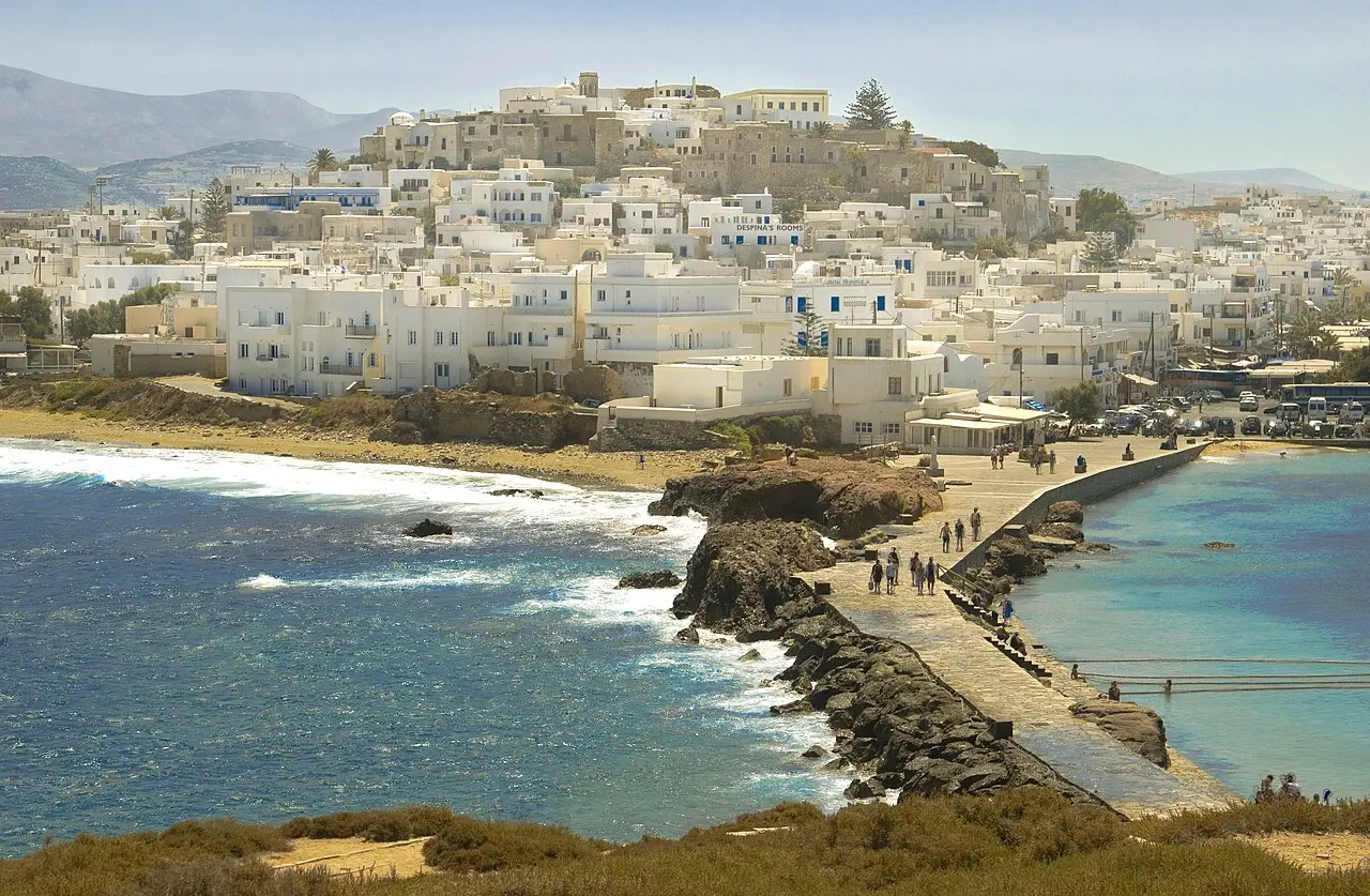 Naxos Chora rising in white cubes from the harbour, with the Kastro on the hill