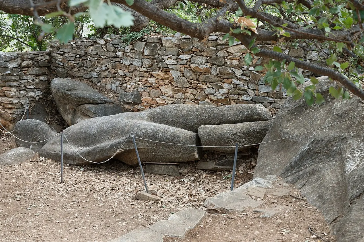The unfinished 6th-century BC kouros lying on its back in an orchard at Flerio, Melanes, Naxos